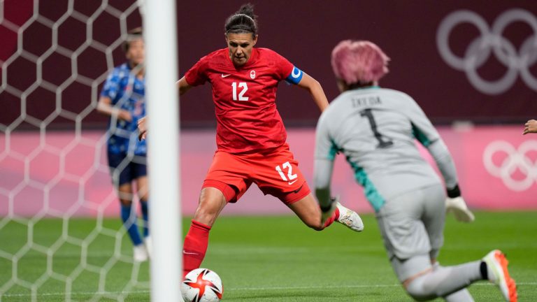 Canada's Christine Sinclair (12) scores a goal against Japan at the 2020 Summer Olympics. (Silvia Izquierdo/AP) 