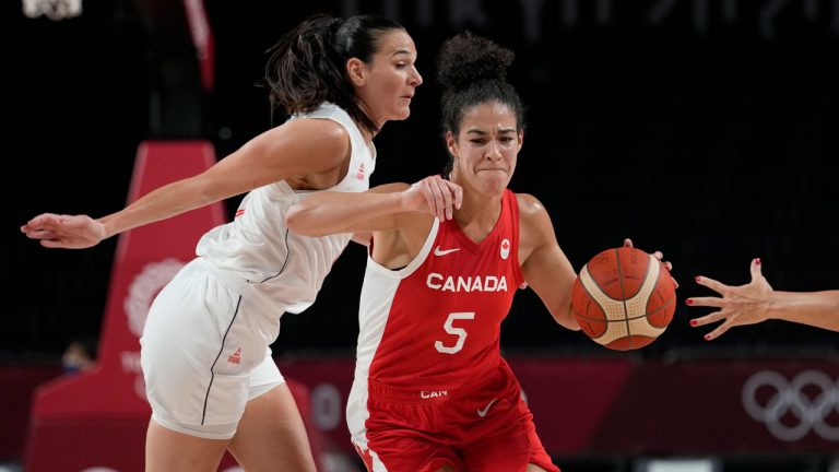 Canada's Kia Nurse (5) drives around Serbia's Sonja Vasic, left, during a women's basketball game at the 2020 Summer Olympics. (Eric Gay/AP) 