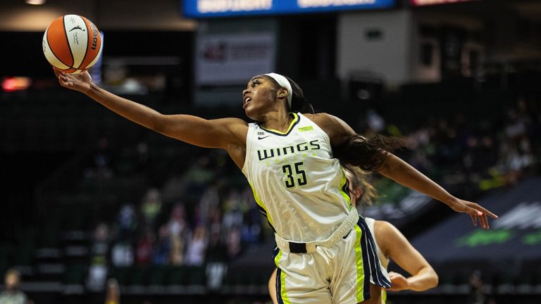 Dallas Wings center Charli Collier stretches for a defensive rebound during a WNBA basketball game against the Seattle Storm on June 4, 2021. (Dean Rutz/The Seattle Times via AP)