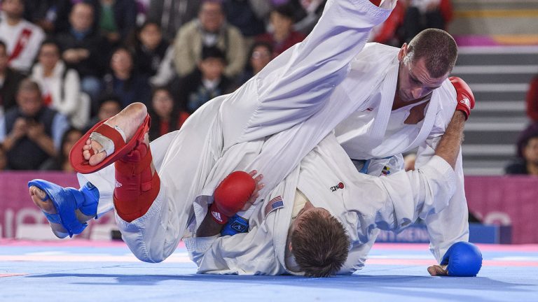 Daniel Gaysinsky of Canada, blue, battles against Brian Irr of the United States in men's over 84kg final karate at the Lima 2019 Pan American Games. (THE CANADIAN PRESS/HO, COC, Vincent Ethier)