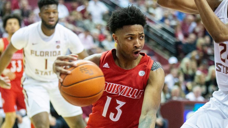 Louisville guard David Johnson (13) drives under the Florida State basket in the first half of an NCAA college basketball game in Tallahassee, Fla., Monday, Feb. 24, 2020. (Mark Wallheiser/AP)