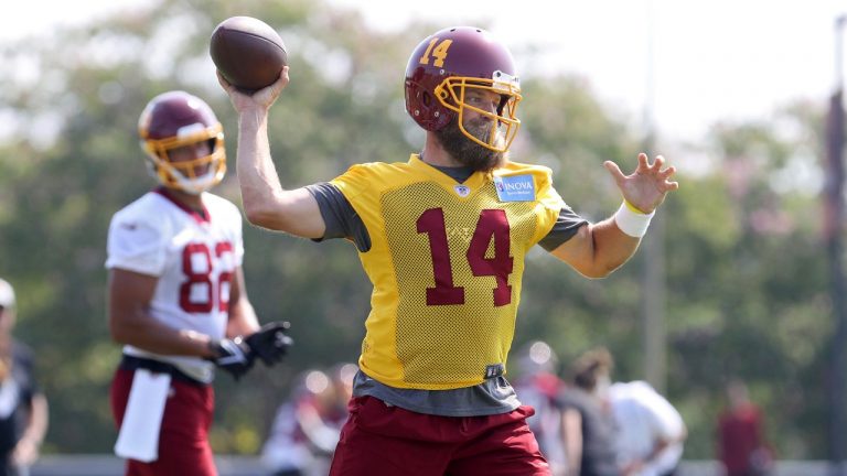 Washington Football Team quarterback Ryan Fitzpatrick (14) throws a pass during NFL football practice in Richmond, Va., Wednesday, July 28, 2021. (Ryan M. Kelly/AP) 