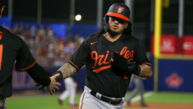 Baltimore Orioles' Freddy Galvis scores after Anthony Santander hit an RBI-single during the eighth inning of a baseball game against the Toronto Blue Jays in Buffalo, N.Y., Friday, June 25, 2021. (Joshua Bessex/AP)