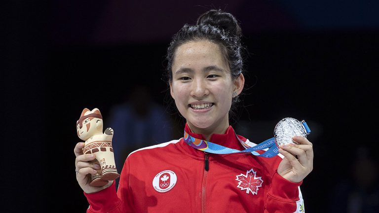 Canada's Jessica Guo displays her silver medal in women’s foil at the 2019 Pan Am Games in Lima, Peru. (Andrew Vaughan/CP)