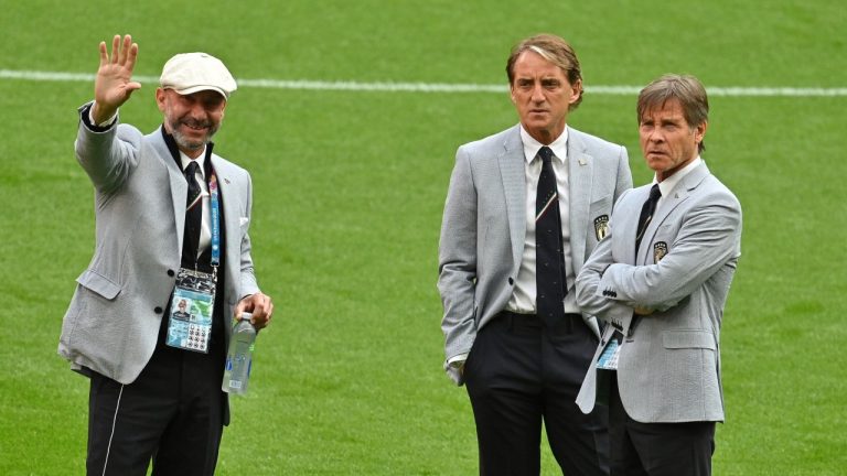 Italy delegation chief Gianluca Vialli and Italy coach Roberto Mancini, center, before the the Euro 2020 soccer championship round of 16 match between Italy and Austria at Wembley stadium in London, Saturday, June 26, 2021.(Justin Tallis/AP) 