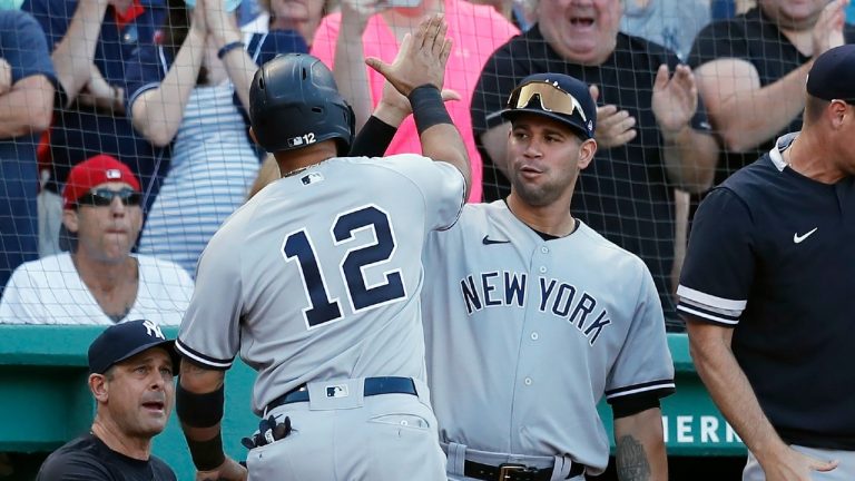 New York Yankees' Rougned Odor (12) celebrates after scoring on an RBI-single by Gleyber Torres during the eighth inning of a baseball game against the Boston Red Sox, Saturday, July 24, 2021, in Boston. (Michael Dwyer/AP) 