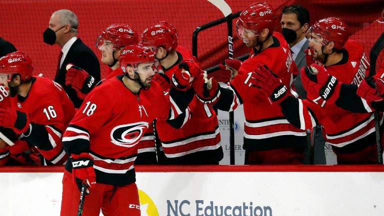 Carolina Hurricanes' Cedric Paquette (18) celebrates a goal against the Tampa Bay Lightning during the third period of an NHL hockey game in Raleigh, N.C., Saturday, Feb. 20, 2021. (Karl B DeBlaker/AP) 