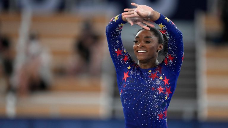 Simone Biles, of the United States, performs her floor exercise during the women's artistic gymnastic qualifications at the 2020 Summer Olympics. (AP) 