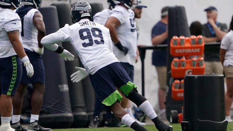 Seattle Seahawks defensive end Aldon Smith runs a drill during NFL football practice Saturday, July 31, 2021, in Renton, Wash. (Ted S. Warren/AP)