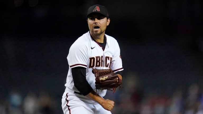 Arizona Diamondbacks' Joakim Soria shouts as he celebrates the final out against the San Francisco Giants in a baseball game Thursday, July 1, 2021, in Phoenix. The Diamondbacks won 5-3. (Ross D. Franklin/AP) 
