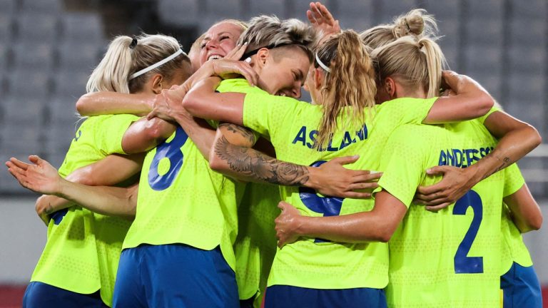 Sweden's midfielder Lina Hurtig (Front L) celebrates with teammates after she scored the third goal during the Tokyo 2020 Olympic Games women's group G first round football match between Sweden and USA at the Tokyo Stadium. (Yoshikazu Tsuno/ Getty Images)