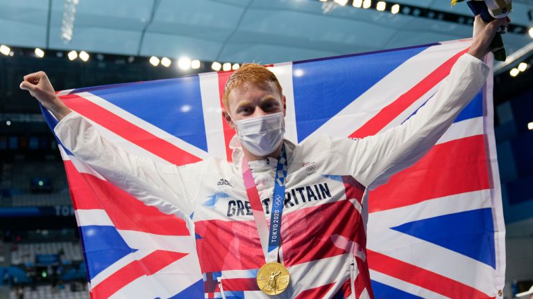 Tom Dean of Britain celebrates after winning the men's 200-meter freestyle at the 2020 Summer Olympics. (Martin Meissner/AP) 