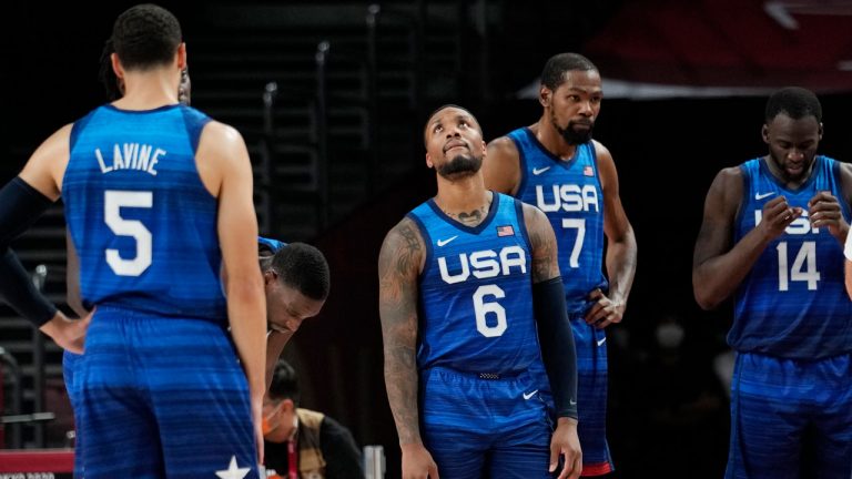 United States' Damian Lillard (6), Kevin Durant (7), and Draymond Green (16) their loss to France in wait for play to resume during their loss to France in a men's basketball preliminary round game at the 2020 Summer Olympics. (Eric Gay/AP) 