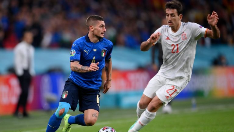 Italy's Marco Verratti, left, takes on Spain's Mikel Oyarzabal during the Euro 2020 semifinal between Italy and Spain at Wembley stadium in London, Tuesday, July 6, 2021. (Laurence Griffiths, Pool via AP) 