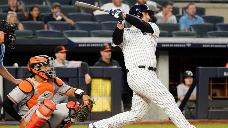 New York Yankees first baseman Anthony Rizzo watches the ball after hitting a solo home run in the fourth inning against the Baltimore Orioles. (Mary Altaffer/AP)