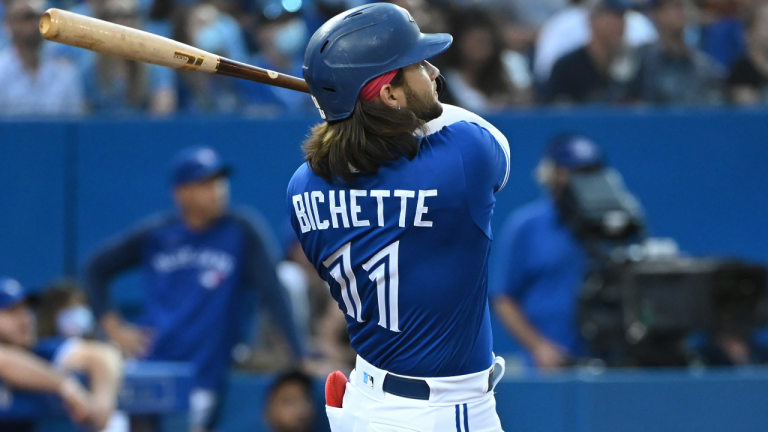 Toronto Blue Jays shortstop Bo Bichette (11) watches his two run home run which scored teammate Vladimir Guerrero Jr. during fourth inning AL baseball game action against the Cleveland Indians in Toronto on Thursday Aug. 5, 2021. (Jon Blacker / CP) 