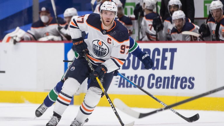 Edmonton Oilers' Connor McDavid skates with the puck during the first period of an NHL hockey game against the Vancouver Canucks in Vancouver, on Tuesday, May 4, 2021. Darryl Dyck/CP
