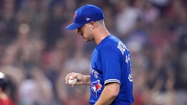 Trevor Richards of the Toronto Blue Jays pitches against the Texas