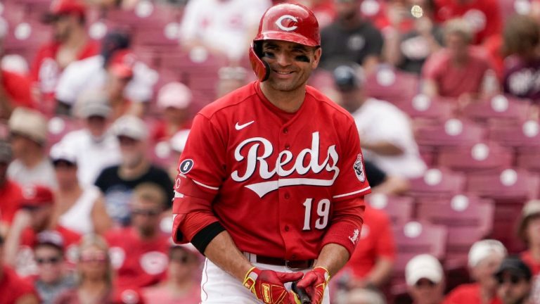 Cincinnati Reds star Joey Votto smiles while preparing to take an at-bat during the fifth inning of a game against the Miami Marlins. (Jeff Dean/AP)