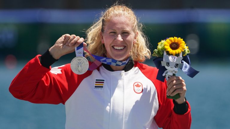 Laurence Vincent-Lapointe, of Canada, reacts while wearing her silver medal after competing in the canoe sprint women's C-1 200m A finals at the 2020 Summer Olympics, Thursday, Aug. 5, 2021, in Tokyo, Japan. The 29-year-old paddler from Trois-Rivieres, Que., finished the sprint in a time of 46.786 seconds, behind American Nevin Harrison. (Nathan Denette/CP)