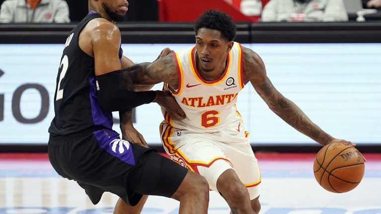 Atlanta Hawks guard Lou Williams (6) drives around former Toronto Raptors guard Rodney Hood (32). (Chris O'Meara/AP)