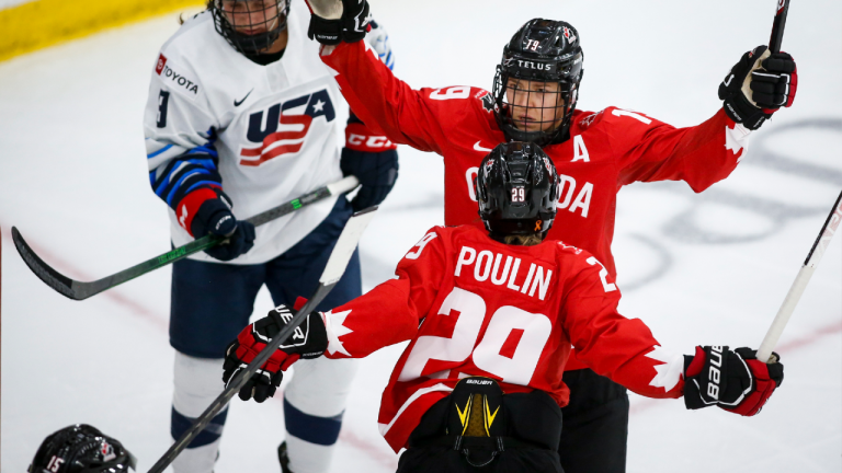 Canada's Brianne Jenner, right, celebrates with teammate Marie-Philip Poulin. (Jeff McIntosh/CP)