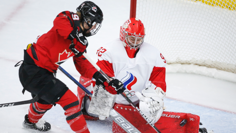 Russia's goalie Nadezhda Morozova, right, stops a shot from Canada's Marie-Philip Poulin during first period IIHF Women's World Championship hockey action in Calgary, Alta., Sunday, Aug. 22, 2021. (Jeff McIntosh / CP)