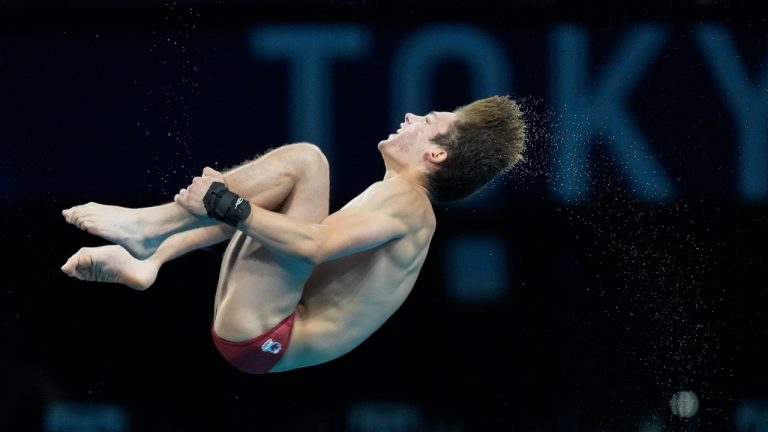 Nathan Zsombor-Murray of Canada competes in men's diving 10m platform preliminary at the Tokyo Aquatics Centre at the 2020 Summer Olympics, Friday, Aug. 6, 2021, in Tokyo, Japan. (Dmitri Lovetsky/AP)