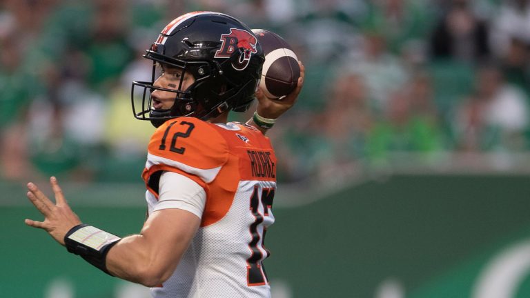 BC Lions quarterback Nathan Rourke (12) throws the ball downfield during the first half of CFL football action. (Kayle Neis/CP)