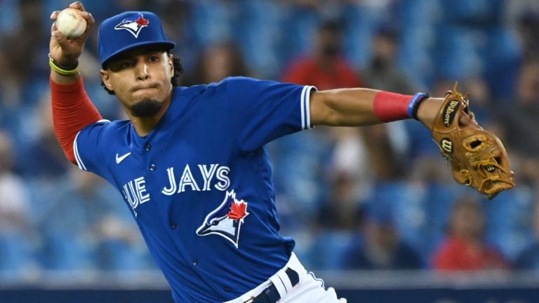 Toronto Blue Jays' Santiago Espinal throws out Boston Red Sox Enrique Hernandez at first base in the third inning of game one of a double header American League baseball game in Toronto on Saturday Aug. 7, 2021 (Jon Blacker/CP).