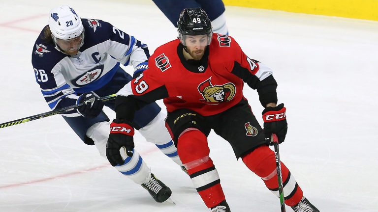 Ottawa Senators right wing Scott Sabourin (49) skates with the puck as Winnipeg Jets right wing Blake Wheeler (26) defends during third period NHL action in Ottawa. (Fred Chartrand/CP)