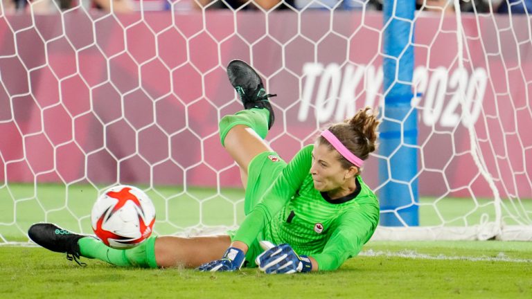 Canada's Stephanie Labbe makes a save against Sweden in the sixth round of the penalty shoot-out in the women's soccer final during the summer Tokyo Olympics. (Frank Gunn/CP)