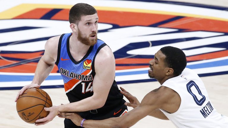 Oklahoma City Thunder guard Svi Mykhailiuk (14) goes against Memphis Grizzlies guard De'Anthony Melton (0) during the second half of an NBA basketball game, Wednesday, March 24, 2021, in Oklahoma City. (Garett Fisbeck/AP)