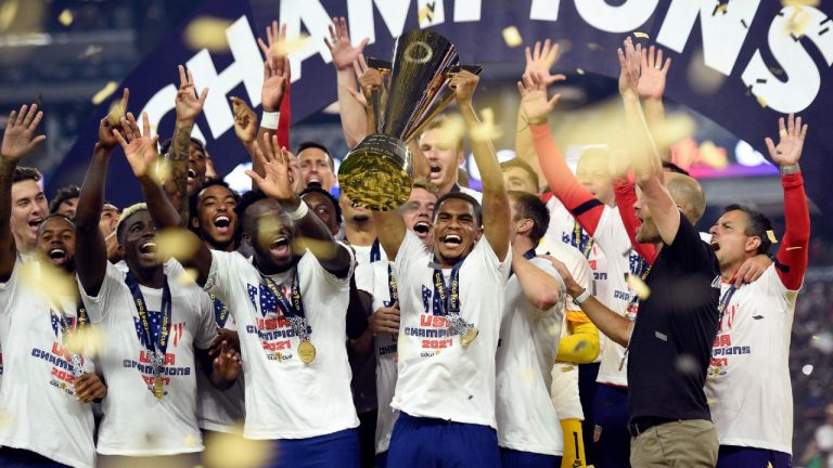 The United States celebrate their extra-time victory over Mexico in the CONCACAF Gold Cup. (David Becker/AP)