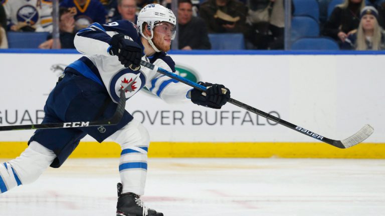 Winnipeg Jets forward Andrew Copp (9) shoots during the second period of an NHL hockey game against the Buffalo Sabres, Sunday, Feb. 10, 2019, in Buffalo N.Y. (Jeffrey T. Barnes/AP) 
