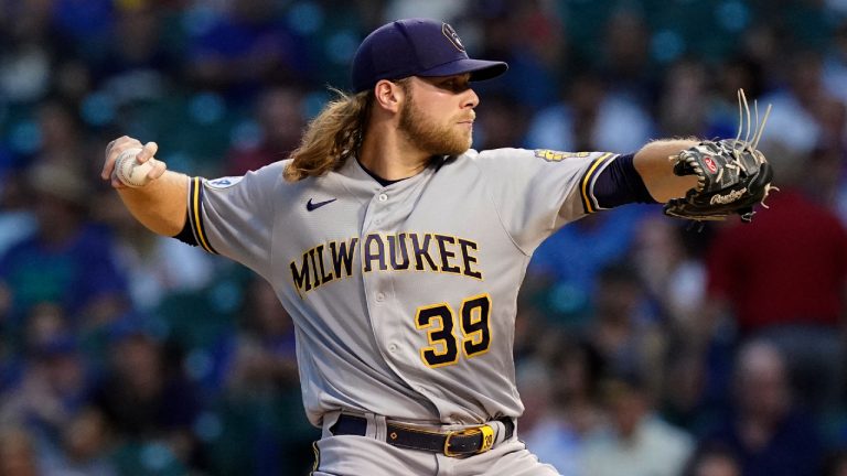 Milwaukee Brewers starting pitcher Corbin Burnes throws to a Chicago Cubs batter during the first inning of a baseball game in Chicago, Wednesday, Aug. 11, 2021. (Nam Y. Huh/AP) 
