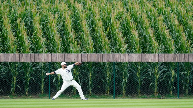 Chicago White Sox pitcher Lance Lynn warms up in the outfield before a baseball game against the New York Yankees, Thursday, Aug. 12, 2021 in Dyersville, Iowa. The Yankees and White Sox are playing at a temporary stadium in the middle of a cornfield at the Field of Dreams movie site, the first Major League Baseball game held in Iowa. (Charlie Neibergall/AP) 
