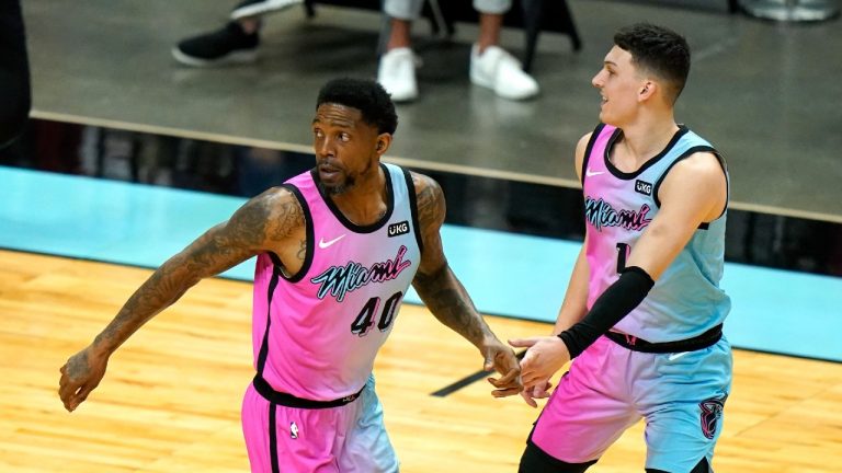 Miami Heat forward Udonis Haslem (40) is congratulated by guard Tyler Herro, right, after scoring during the first half of the team's NBA basketball game against the Philadelphia 76ers, Thursday, May 13, 2021, in Miami. (Lynne Sladky/AP)