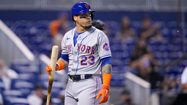 New York Mets' Javier Baez (23) walks to the dugout after striking out in the first inning of a baseball game against the Miami Marlins. (Lynne Sladky/AP) 