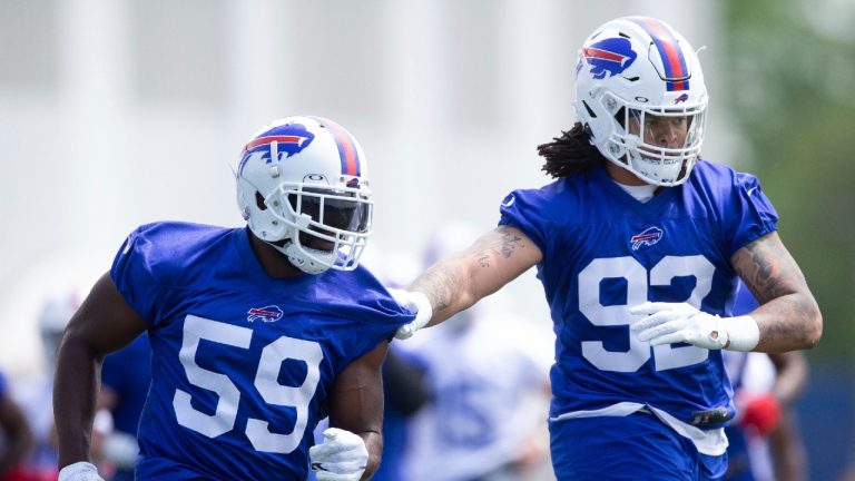 Buffalo Bills linebacker Andre Smith (59) and defensive lineman Darryl Johnson (92) competes in drills during NFL football practice Tuesday, May 25, 2021, in Buffalo, N.Y. (Joshua Bessex/AP)