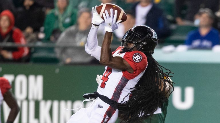 Ottawa Redblacks' Abdul Kanneh (14) makes an interception against the Edmonton Elks during second half CFL action in Edmonton, Alta., on Saturday August 7, 2021. (Jason Franson/CP)