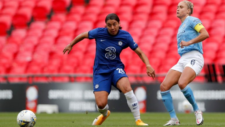 Chelsea's Sam Kerr, left, duels for the ball with Manchester City's Steph Houghton during the English FA Women's Community Shield soccer match between Chelsea and Manchester City at Wembley stadium in London, Saturday, Aug. 29, 2020. (Andrew Couldridge/Pool via AP)