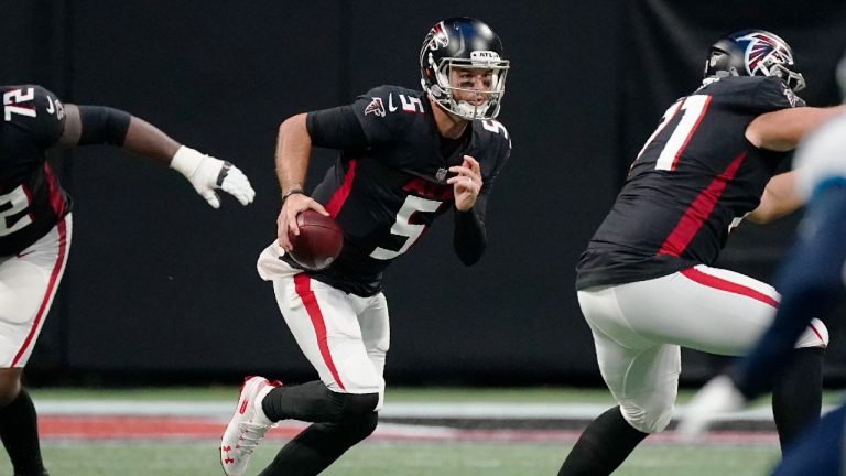 Atlanta Falcons quarterback AJ McCarron (5) runs out of the pocket against the Tennessee Titans during the first half of a preseason NFL football game, Friday, Aug. 13, 2021, in Atlanta. (John Bazemore/AP)