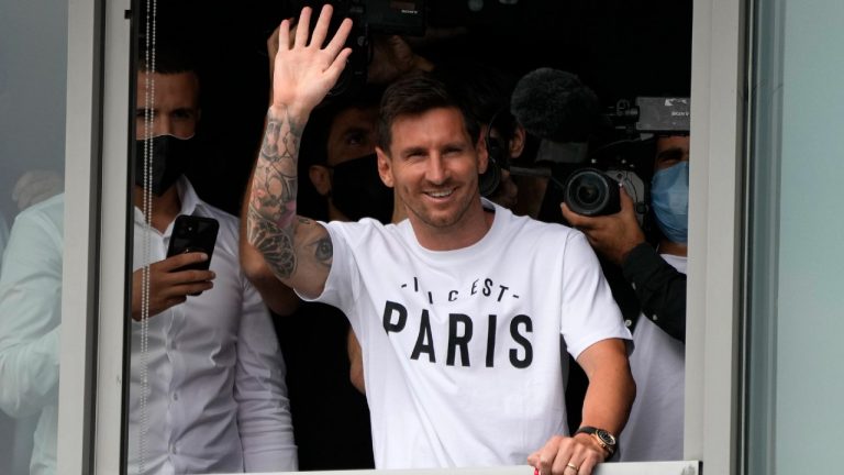 Lionel Messi waves after arriving at Le Bourget airport, north of Paris, Tuesday, Aug. 10, 2021. Lionel Messi finalized agreement on his Paris Saint-Germain contract and was flying to France on Tuesday to complete the move that confirms the end of a career-long association with Barcelona. (Francois Mori/AP)