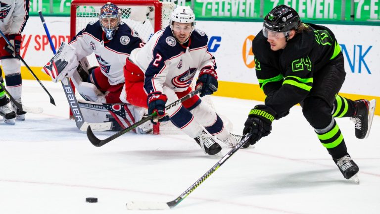 Dallas Stars left wing Roope Hintz (24) skates for the puck as Columbus Blue Jackets defenseman Andrew Peeke (2) pursues during the second period of an NHL hockey game Saturday, April 17, 2021, in Dallas. (Sam Hodde/AP)