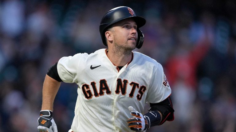 San Francisco Giants' Buster Posey watches his solo home run during the third inning of the team's baseball game against the Arizona Diamondbacks on Wednesday, Aug. 11, 2021, in San Francisco. (Tony Avelar/AP)