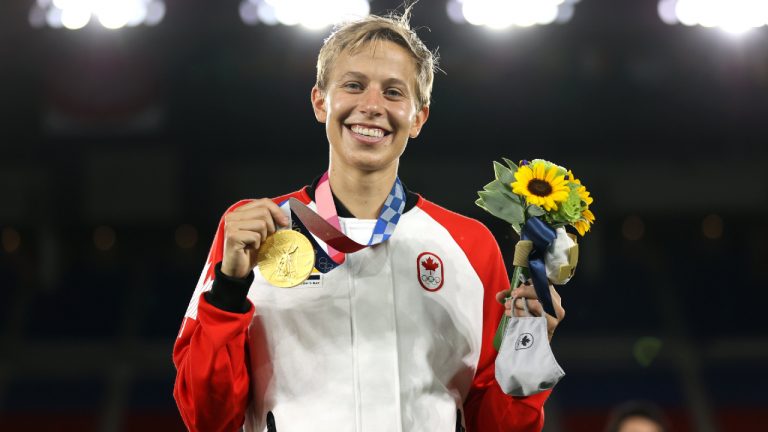 Quinn receives their gold medal, becoming the first openly transgender person to win an Olympic medal, after Canada defeated Sweden in the women's soccer final. (FIFA Women's World Cup/Twitter)