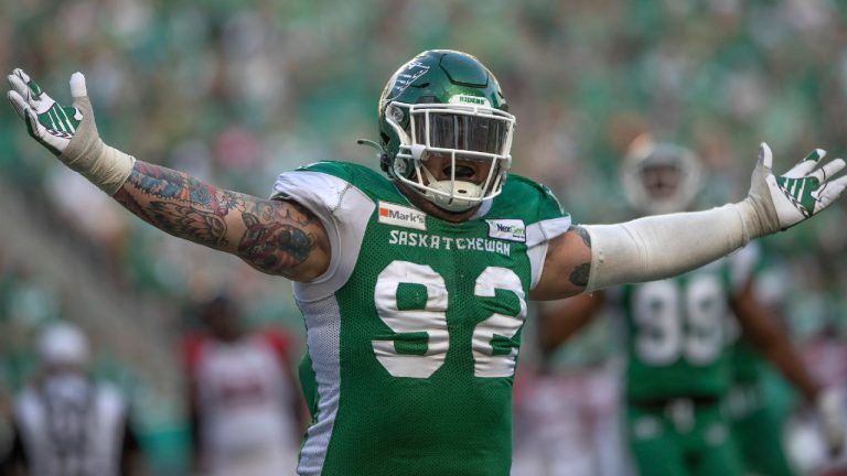 Saskatchewan Roughriders defensive lineman Garrett Marino (92) celebrates after sacking Ottawa Redblacks quarterback Matt Nichols, not shown, during first half CFL football action in Regina on Saturday, August 21, 2021. (Kayle Neis/CP)
