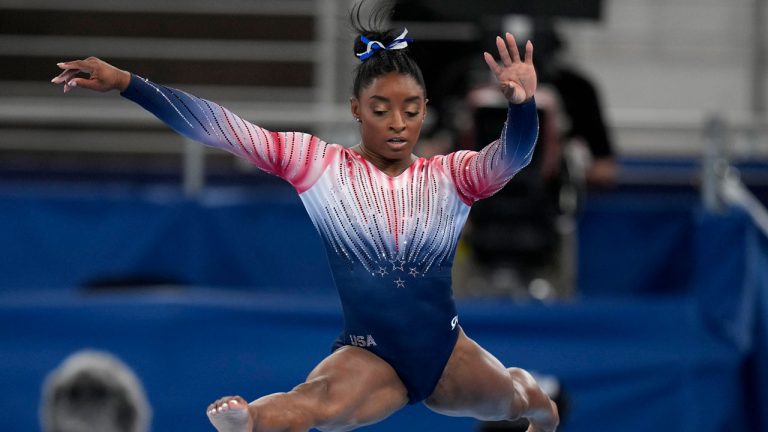 Simone Biles, of the United States, performs on the balance beam during the artistic gymnastics women's apparatus final at the 2020 Summer Olympics. (Jae C. Hong/AP) 