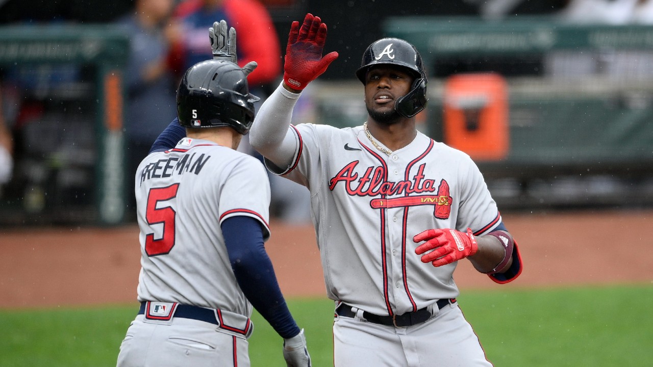 Atlanta Braves outfielder Brian Jordan, right, celebrates with his